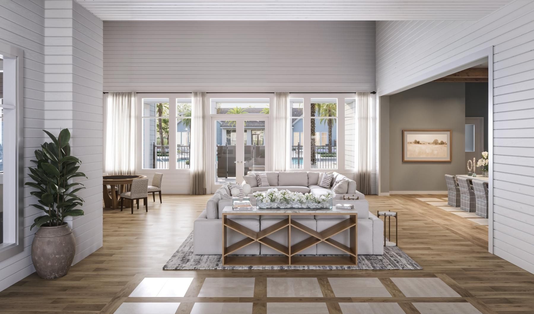a lounge with couches and wood floors