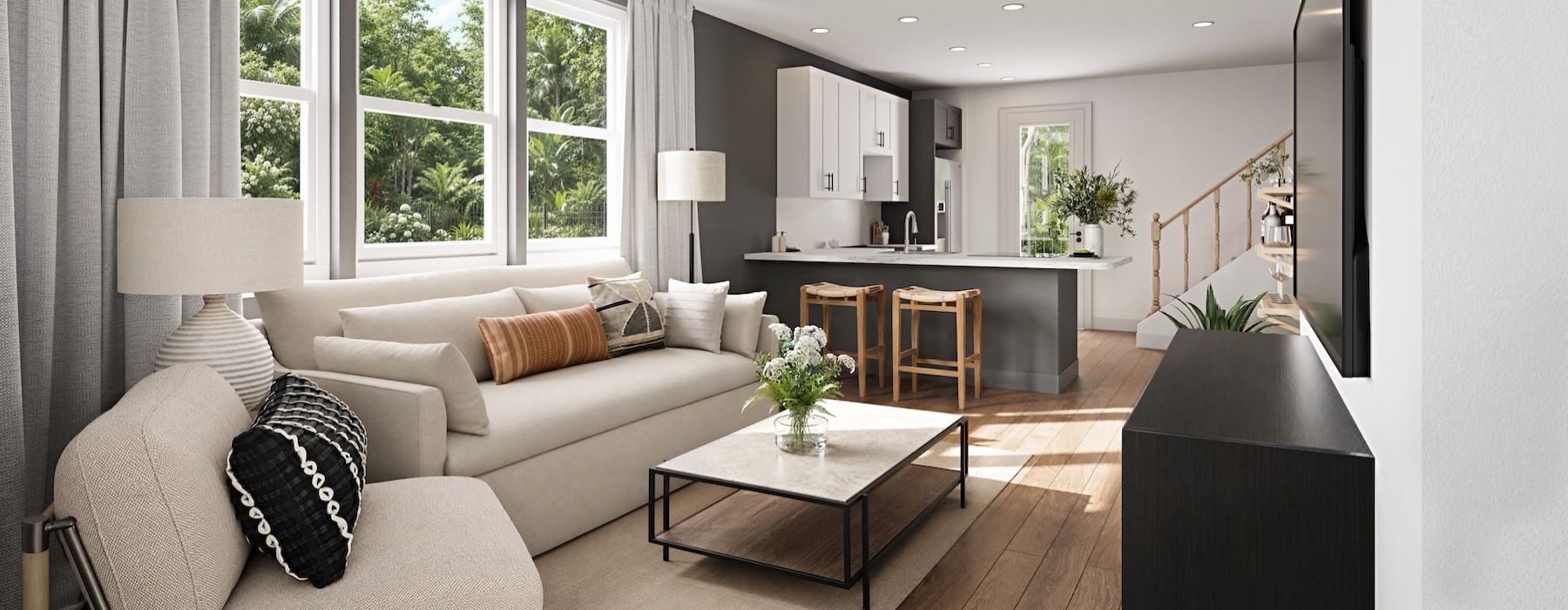 a living room with a couch, coffee table and chairs