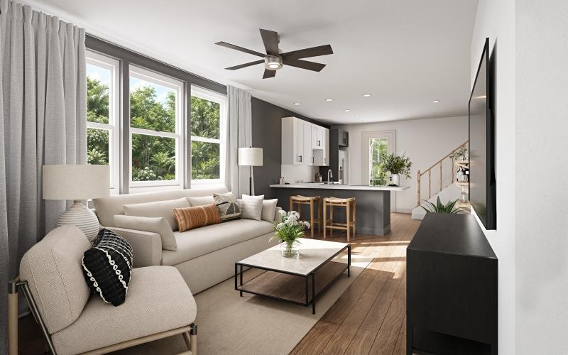 a living room with a couch, coffee table and chairs